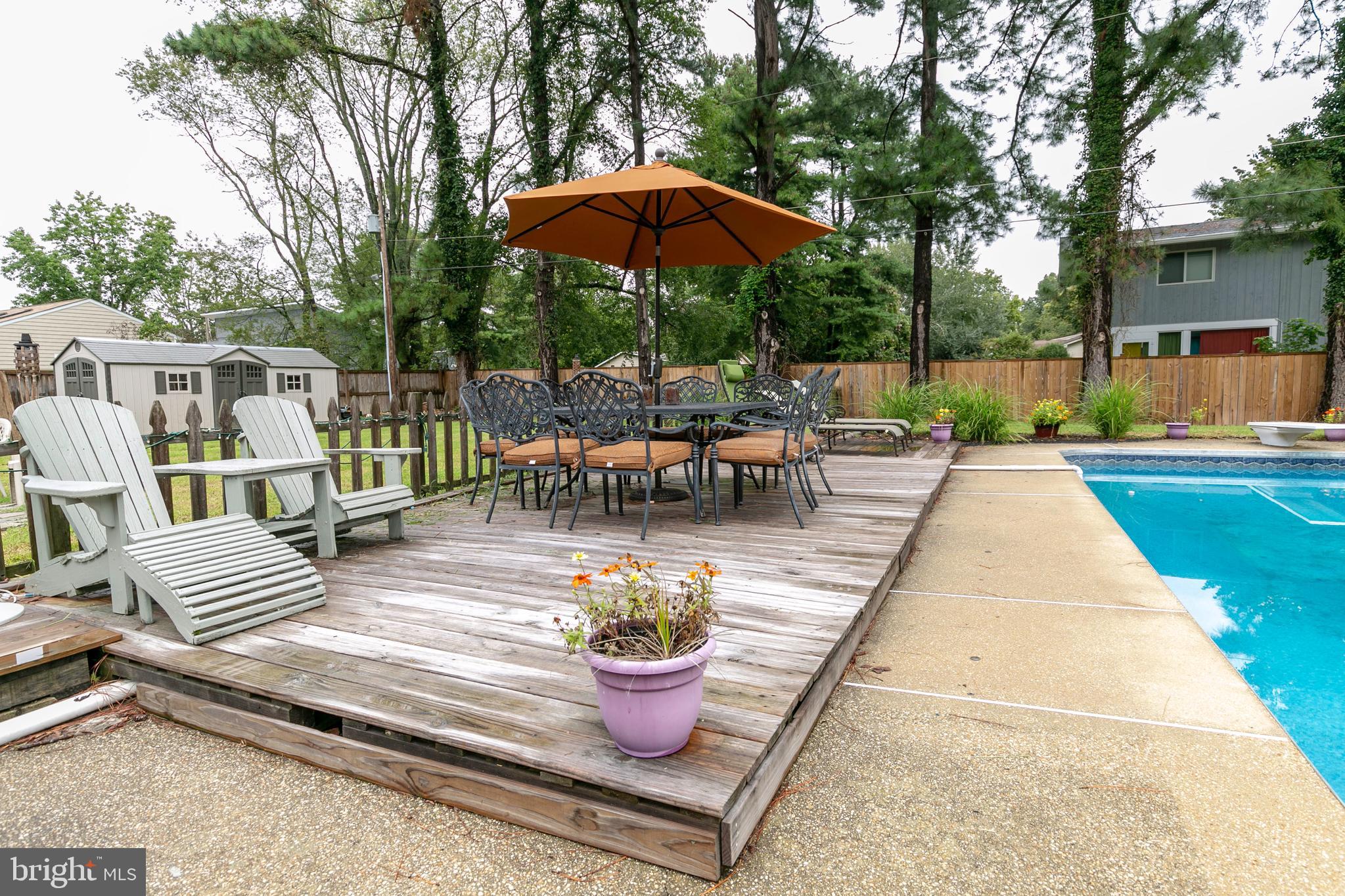 105 Rutledge Road Queenstown, MD 21658 - Photo 27 of 57 Lounging and Dining by the Pool