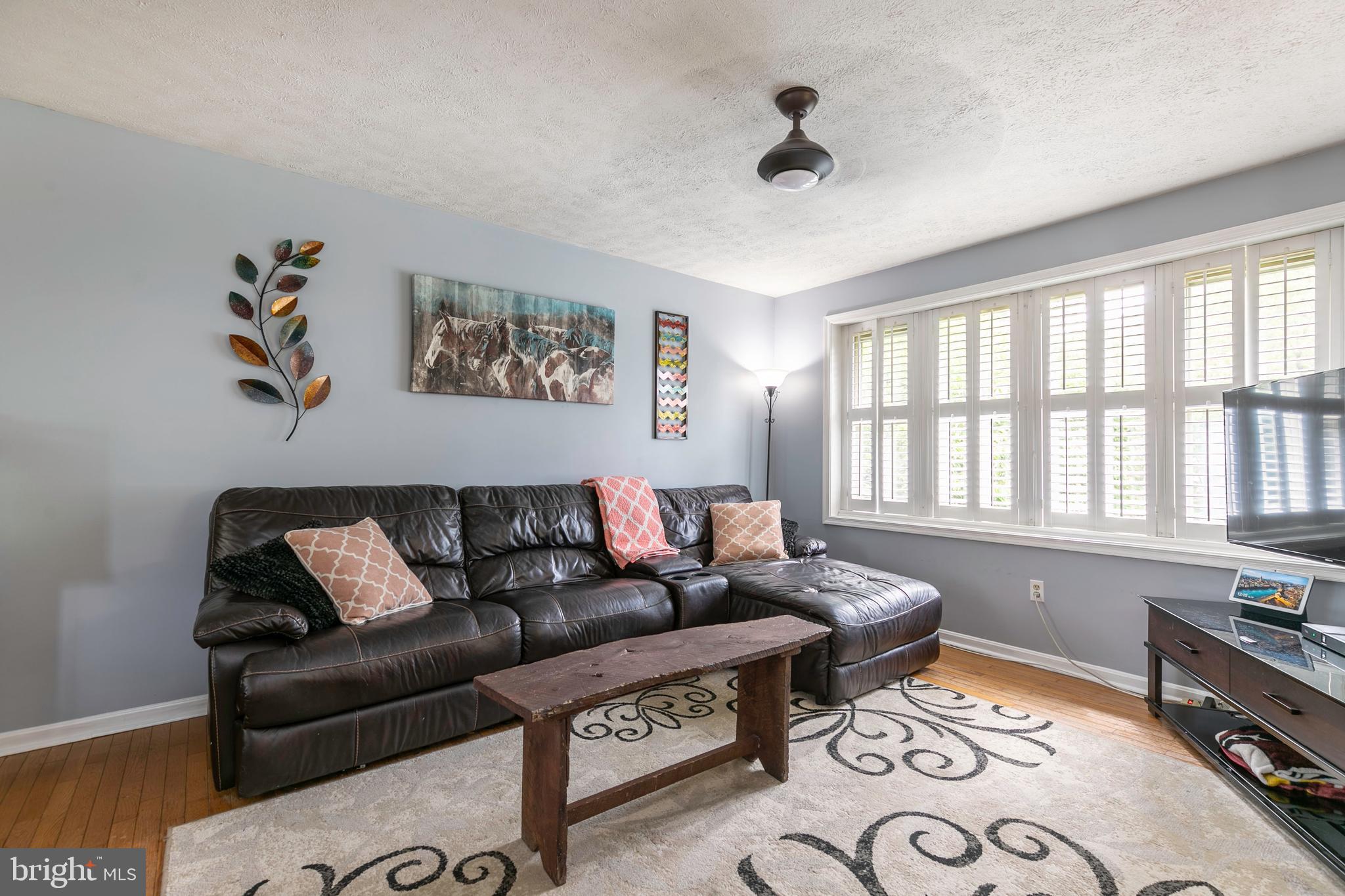 105 Rutledge Road Queenstown, MD 21658 - Photo 6 of 57 Plantation Shutters Enhance the Living Room