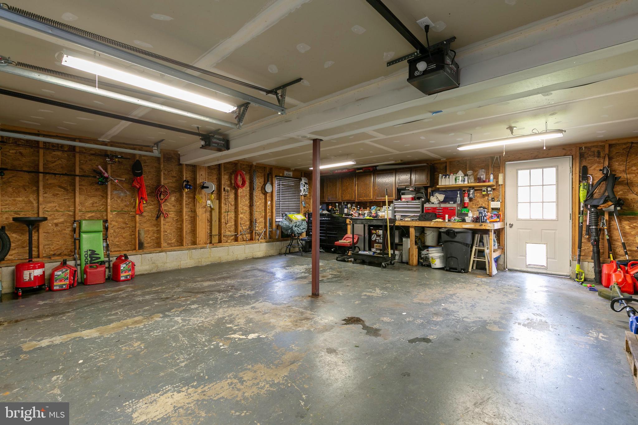 105 Rutledge Road Queenstown, MD 21658 - Photo 56 of 57 Over-sized two car garage with work bench