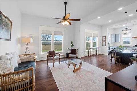 a living room with furniture and a table