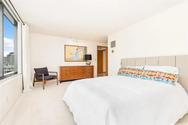 a bedroom with a bed and a table