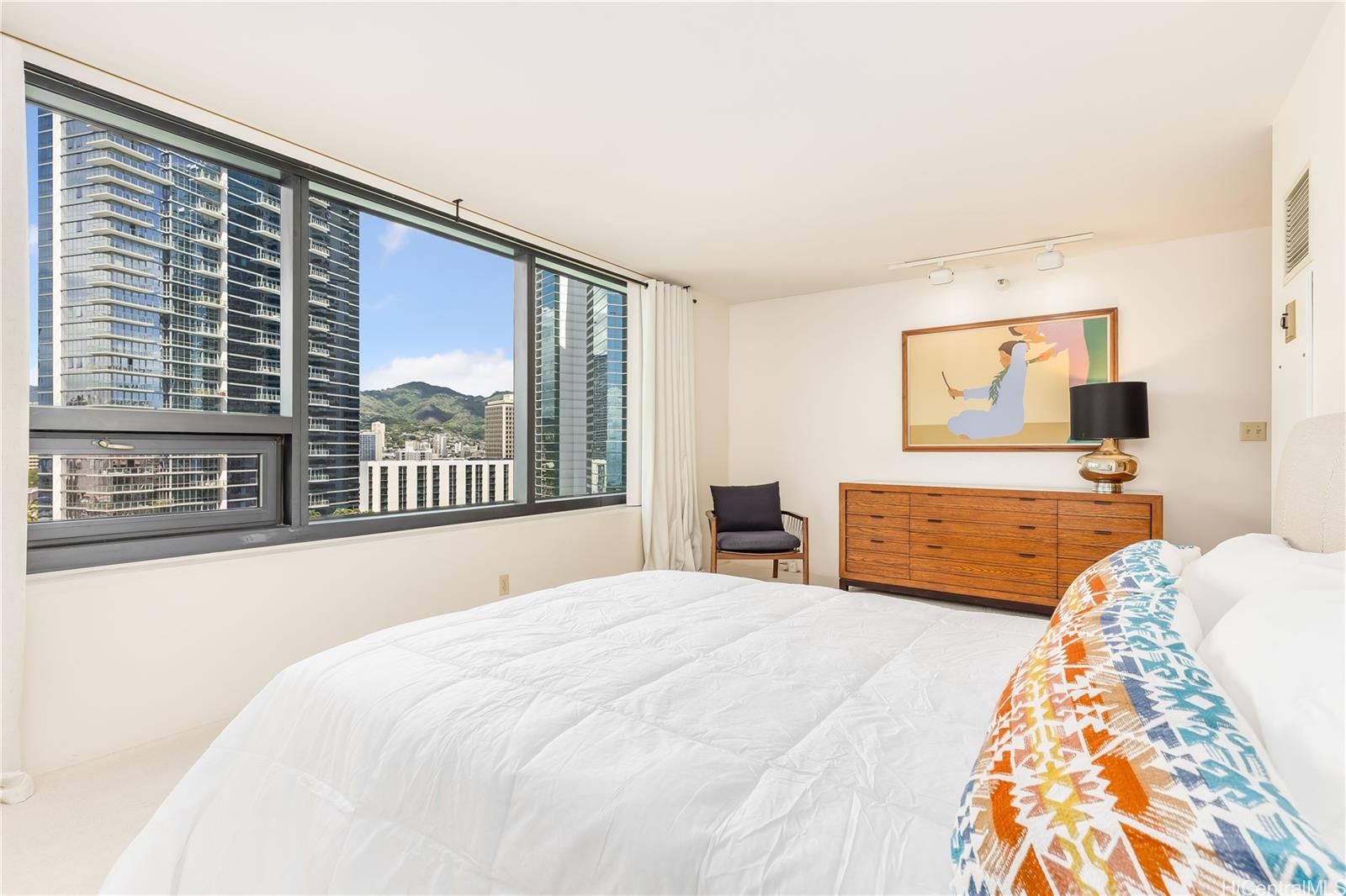 1330 Ala Moana Boulevard, Unit 1308 Honolulu, HI 96814 - Photo 15 of 24 a bedroom with a large bed and a large window