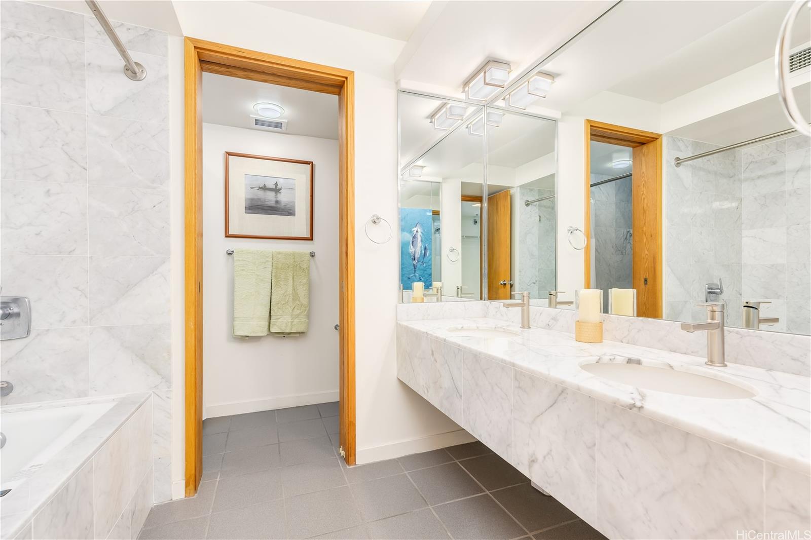 1330 Ala Moana Boulevard, Unit 1308 Honolulu, HI 96814 - Photo 16 of 24 a spacious bathroom with a tub sink and mirror