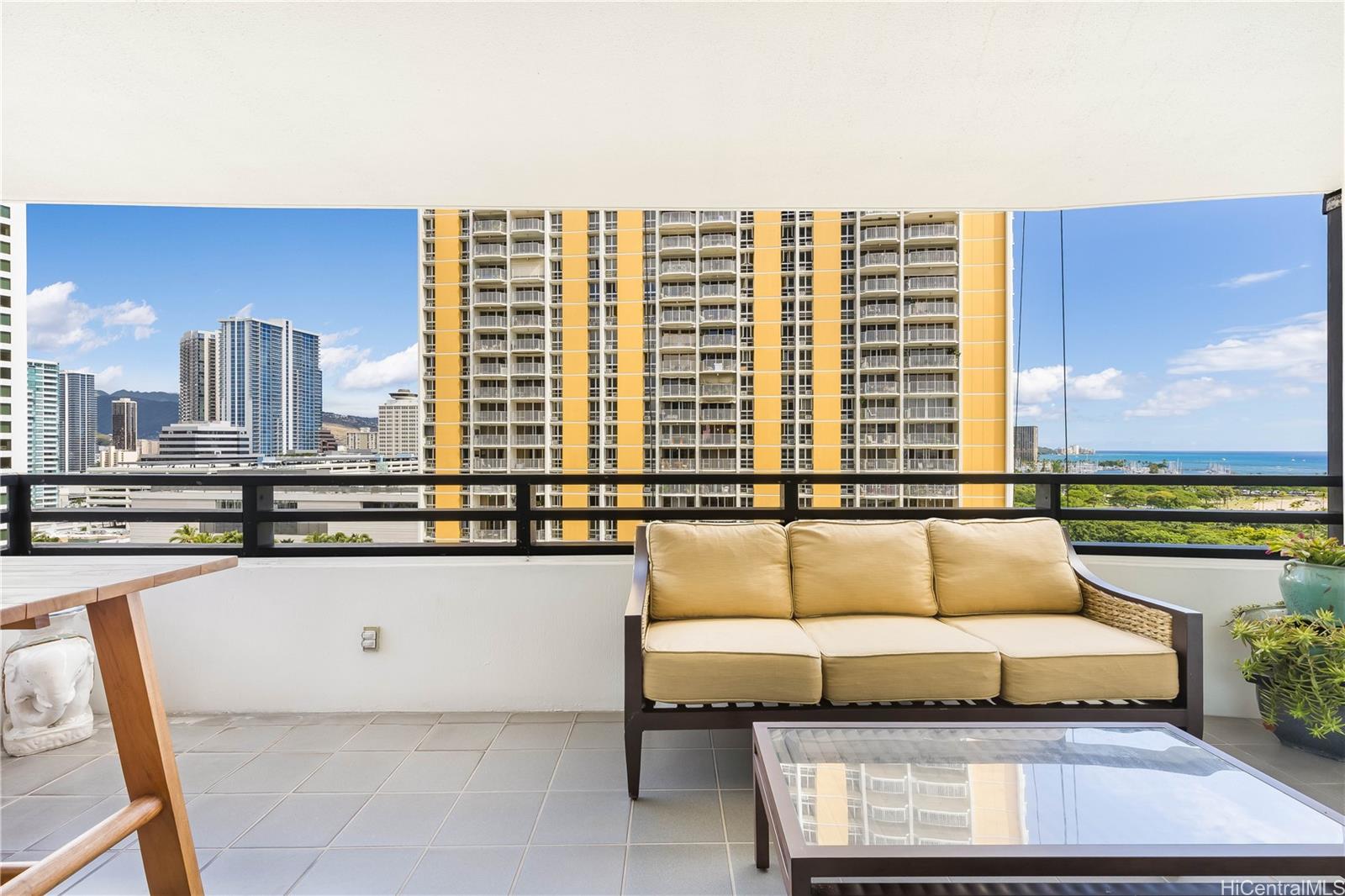1330 Ala Moana Boulevard, Unit 1308 Honolulu, HI 96814 - Photo 20 of 24 a living room with furniture and a floor to ceiling window