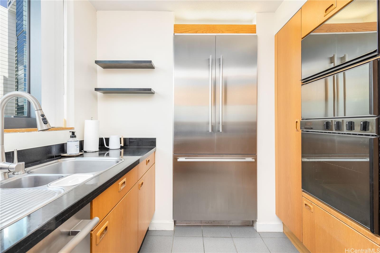 1330 Ala Moana Boulevard, Unit 1308 Honolulu, HI 96814 - Photo 8 of 24 a kitchen with stainless steel appliances granite countertop a refrigerator and a sink