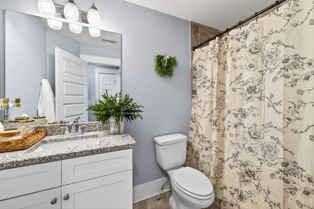 a bedroom with bed and a window