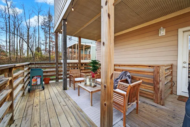 a outdoor living space with furniture and wooden floor