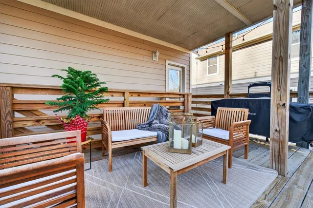 a view of empty room with wooden floor and windows