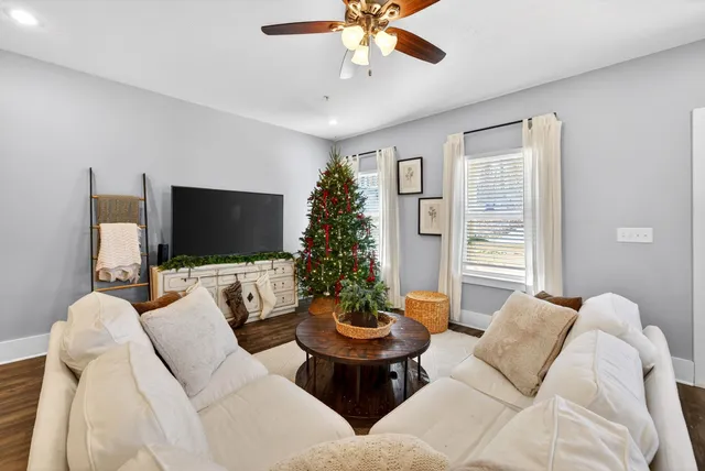 a living room with furniture and a flat screen tv