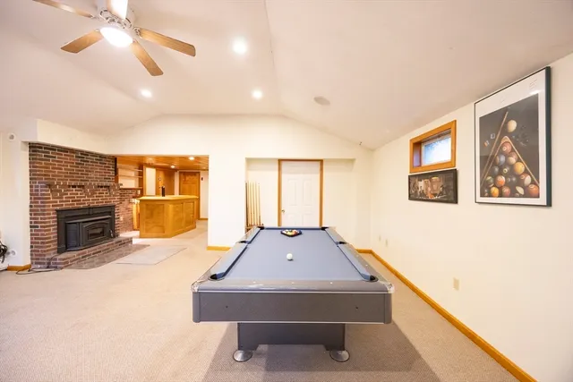 a room with pool table and flat screen tv