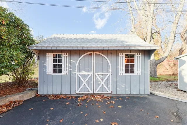 a view of a house with wooden fence