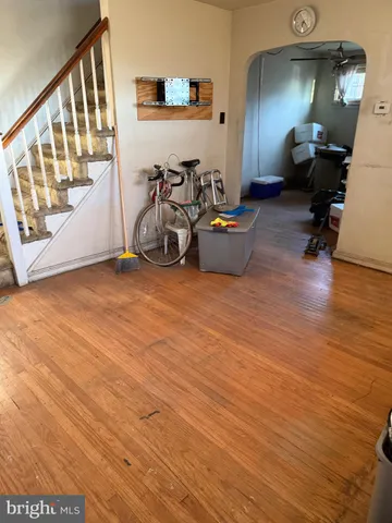 a view of a livingroom with furniture and stairs