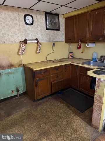 a kitchen with a sink and cabinets