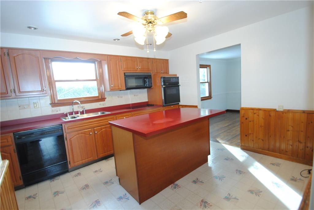 17 Oxford Road Pittsburgh, PA 15202 - Photo 6 of 14 This nice kitchen space has a center island for gathering family & friends plus an abundance of counter space & cabinetry. A side door provides access to the sun porch.