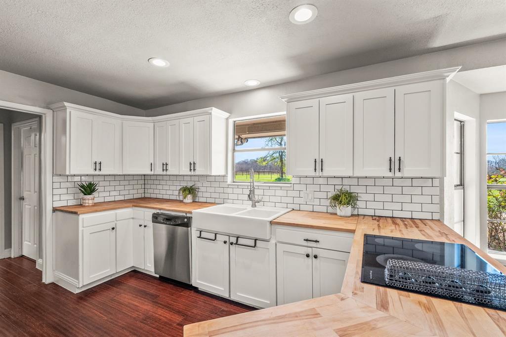 1673 Roadrunner Road Anna, TX 75409 - Photo 27 of 40 Kitchen with butcher block counters and subway tile backsplash