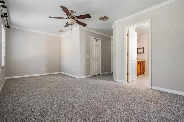 a spacious bathroom with a granite countertop sink and a mirror