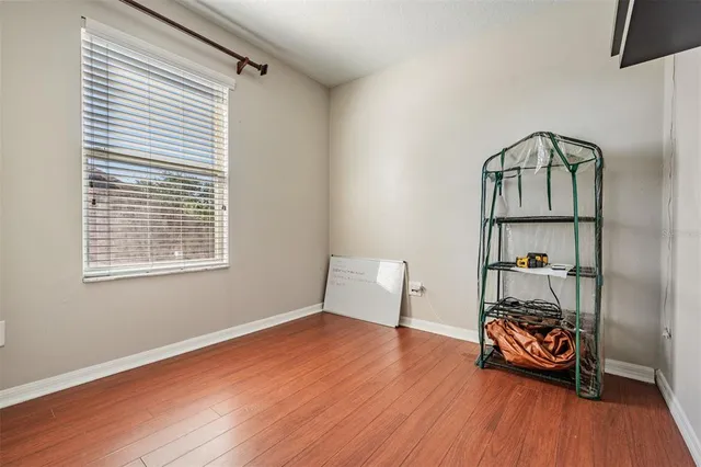 a view of an empty room with windows