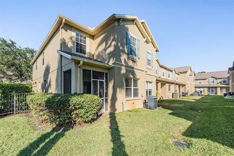a view of a building with a yard