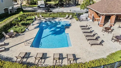a view of a balcony with lake view and a potted plant