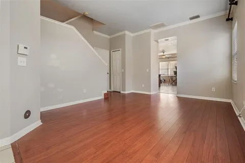 a view of a livingroom with wooden floor