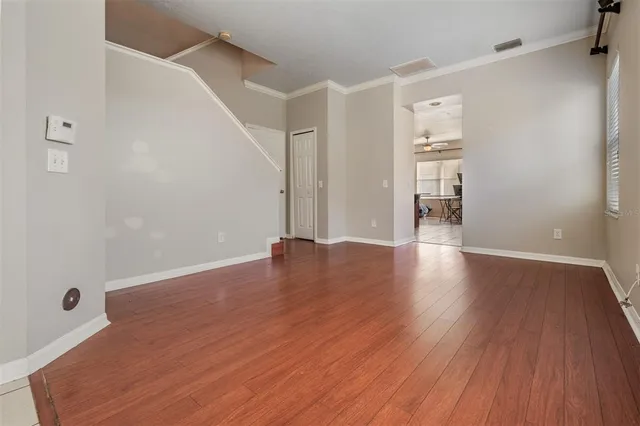 a view of a livingroom with wooden floor