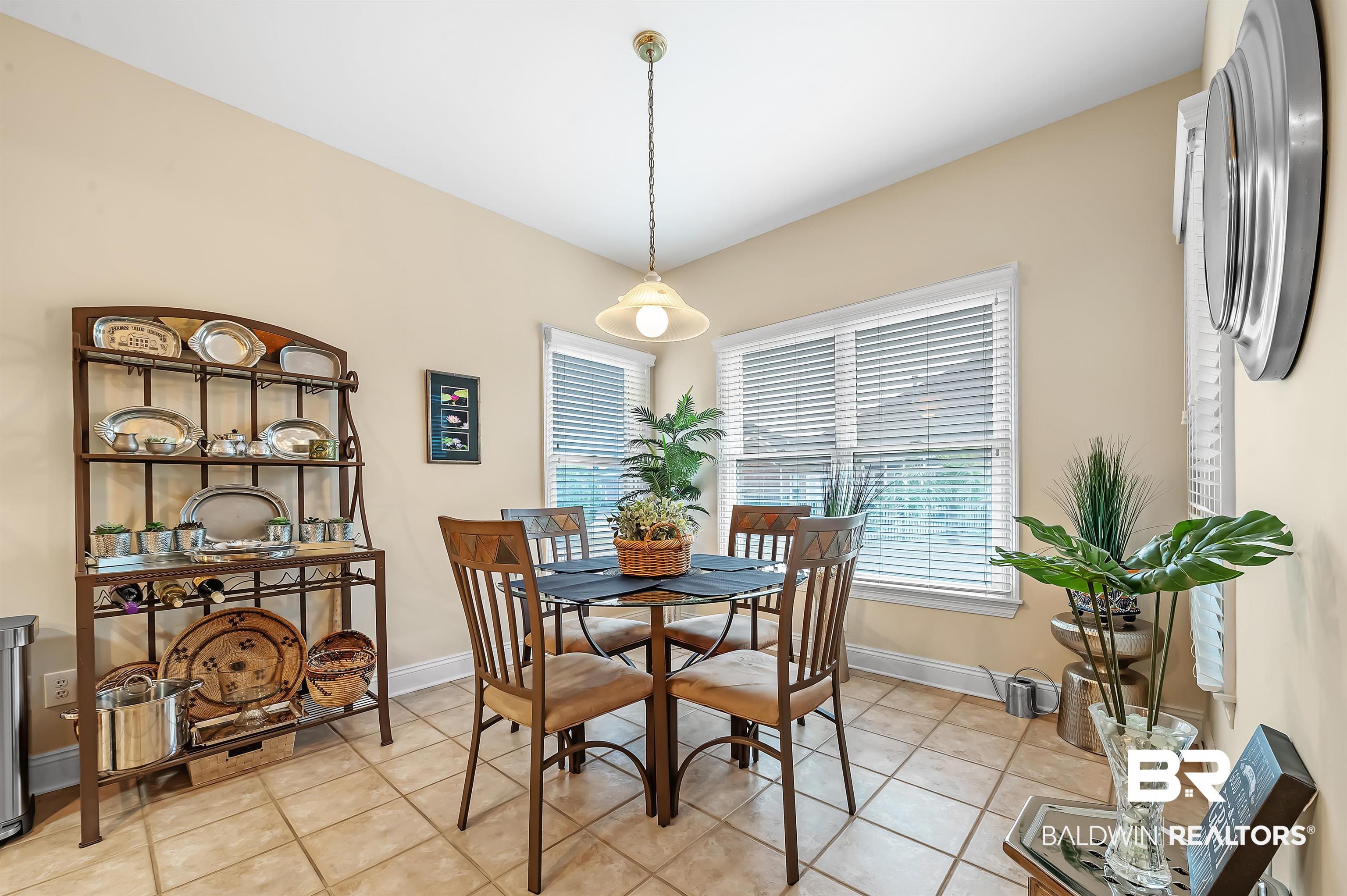 22726 Inverness Way Foley, AL 36535 - Photo 28 of 51 Dining area with light tile patterned flooring