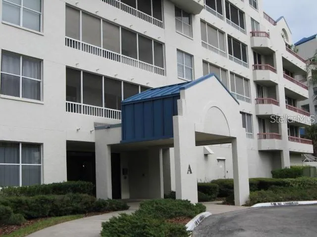 a front view of a building with a garden