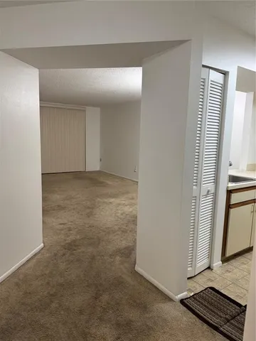 a bathroom with a sink toilet and mirror