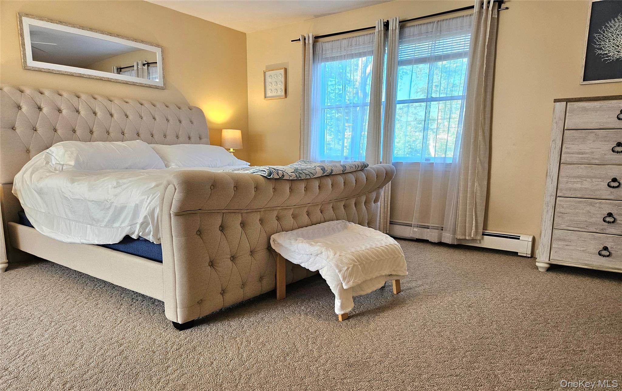 3650 Bay Shore Road Greenport, NY 11944 - Photo 22 of 30 a bedroom with a bed and a dresser