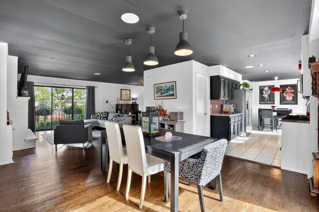 a view of a dining area with furniture and wooden floor