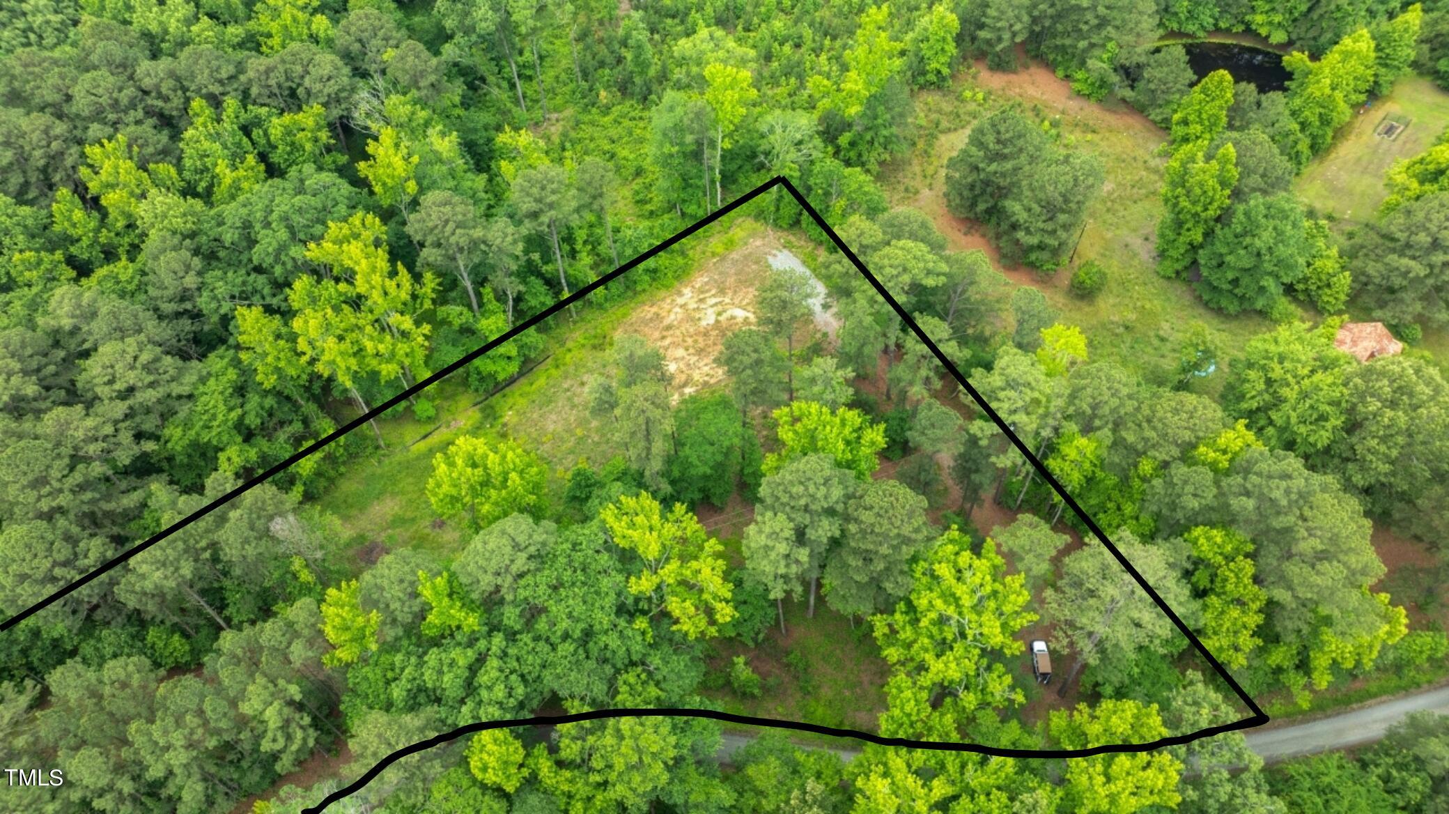 87 Sexton Road Apex, NC 27523 - Photo 6 of 10 a backyard of a house with lots of green space