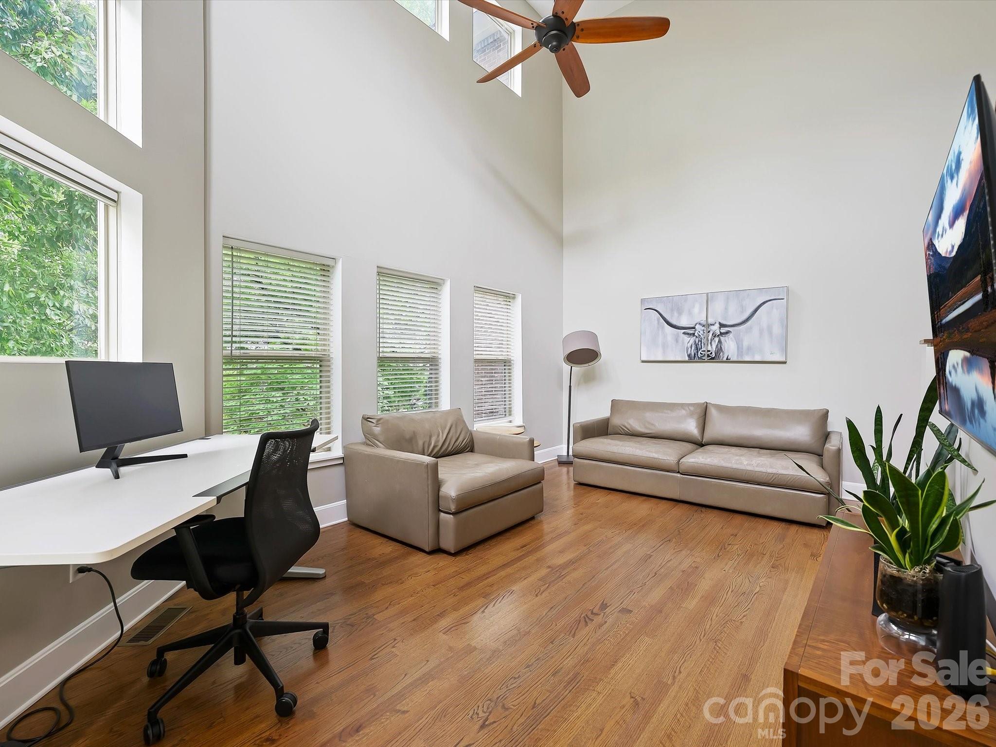 420 Queens Road Charlotte, NC 28207 - Photo 20 of 35 a living room with furniture and a large window
