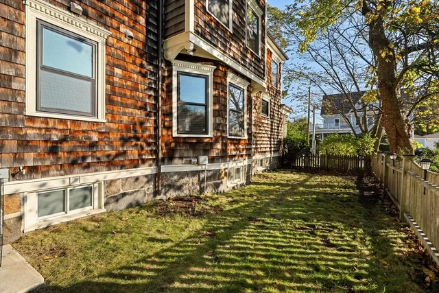 a view of a house with a small yard