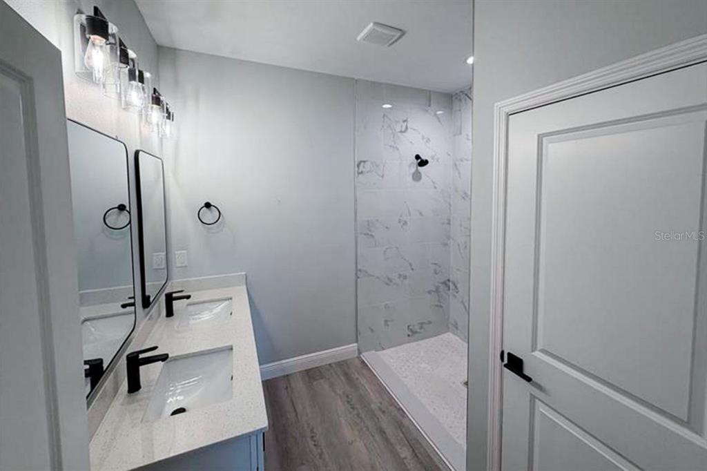 3100 Crowder Street Punta Gorda, FL 33980 - Photo 6 of 6 a bathroom with a sink and a shower