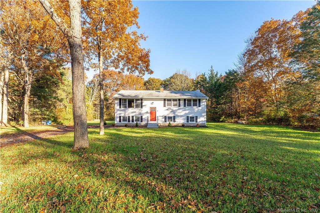 a view of a house with a yard