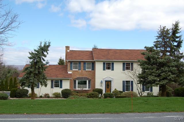 466 Nolf Road Nazareth, PA 18064 - Photo 1 of 27 a front view of a house with a garden