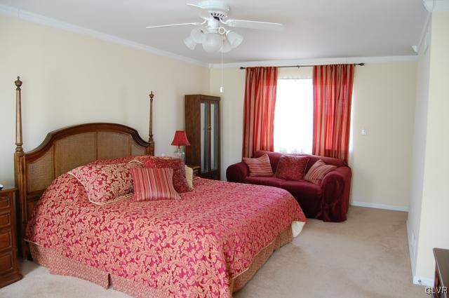 466 Nolf Road Nazareth, PA 18064 - Photo 12 of 27 a bedroom with a bed lamp and a large window