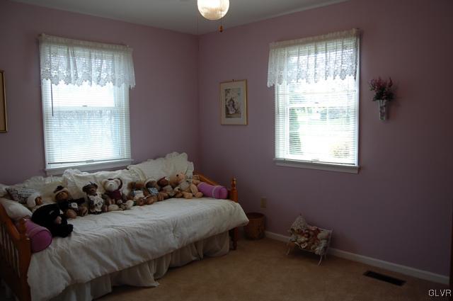 466 Nolf Road Nazareth, PA 18064 - Photo 18 of 27 a bed sitting in a bedroom next to a window