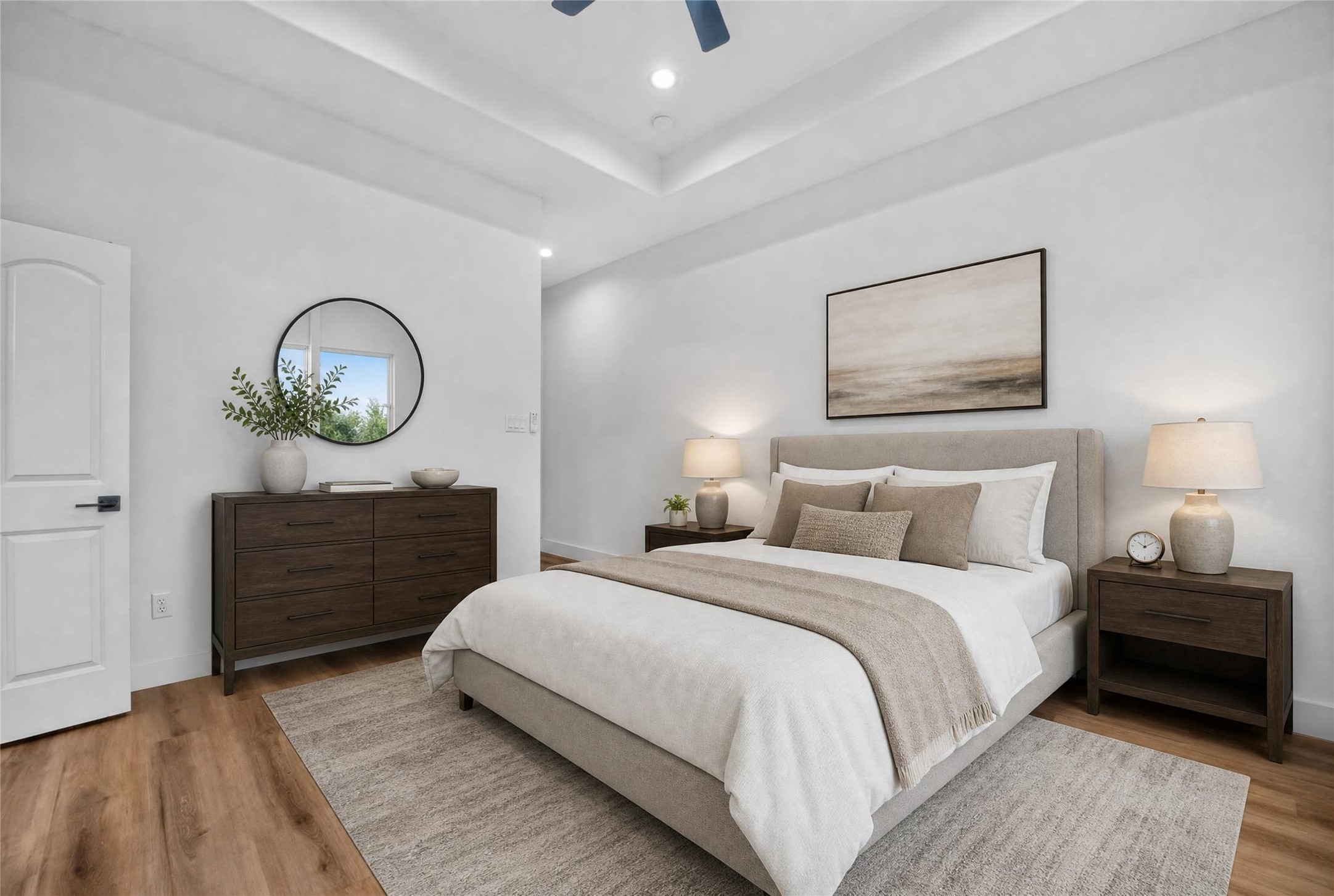 3537 Amos Street Houston, TX 77021 - Photo 5 of 32 Unwind in this spacious second-floor primary suite featuring a recessed ceiling and ceiling fan, creating an airy, comfortable space to relax and recharge. Your modern retreat awaits.