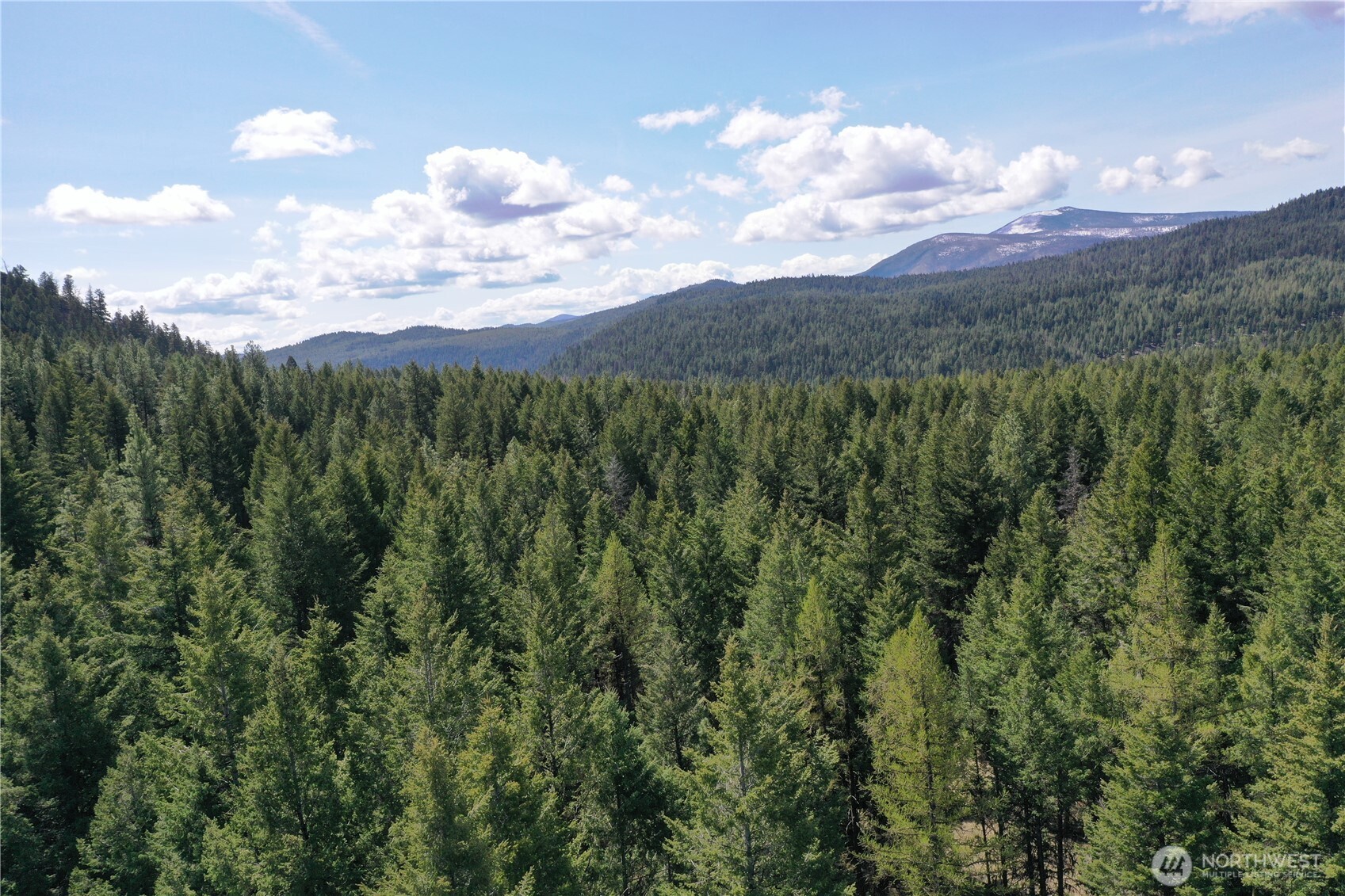 65A Spring Meadow Lane Oroville, WA 98844 - Photo 14 of 40 a view of a city and mountains