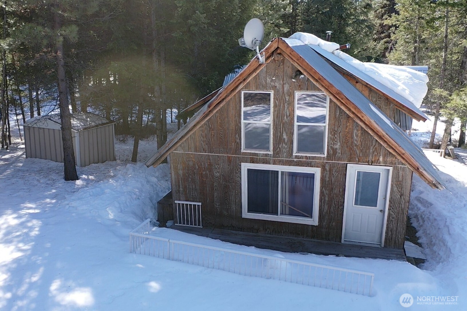 65A Spring Meadow Lane Oroville, WA 98844 - Photo 25 of 40 a front view of a house with a yard