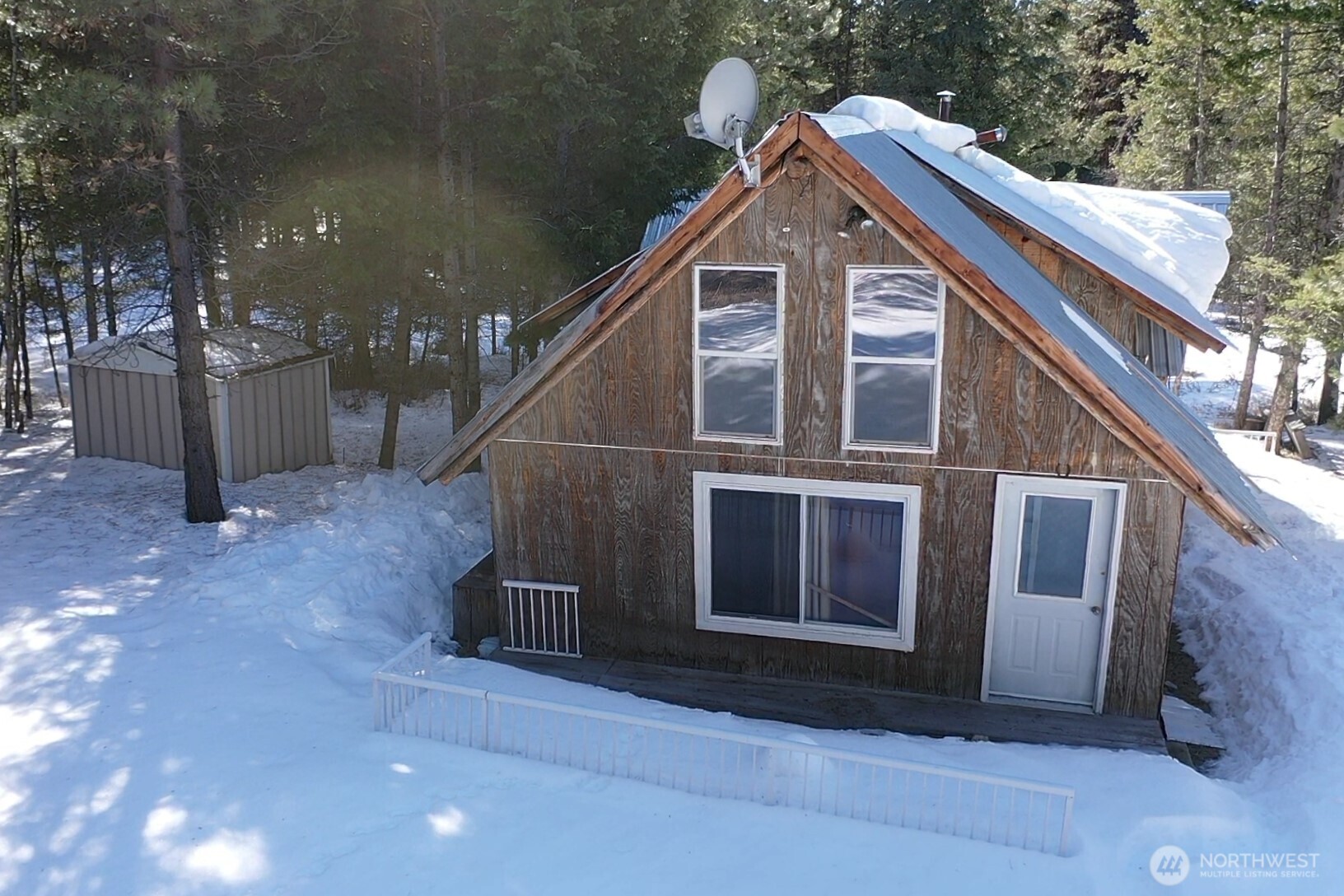 65A Spring Meadow Lane Oroville, WA 98844 - Photo 29 of 40 a front view of a house with a yard