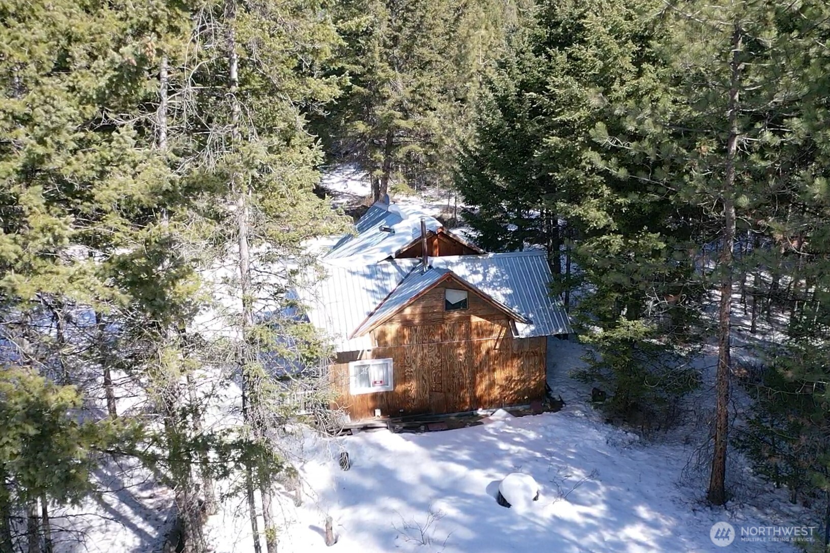 65A Spring Meadow Lane Oroville, WA 98844 - Photo 30 of 40 a backyard of a house with lots of green space
