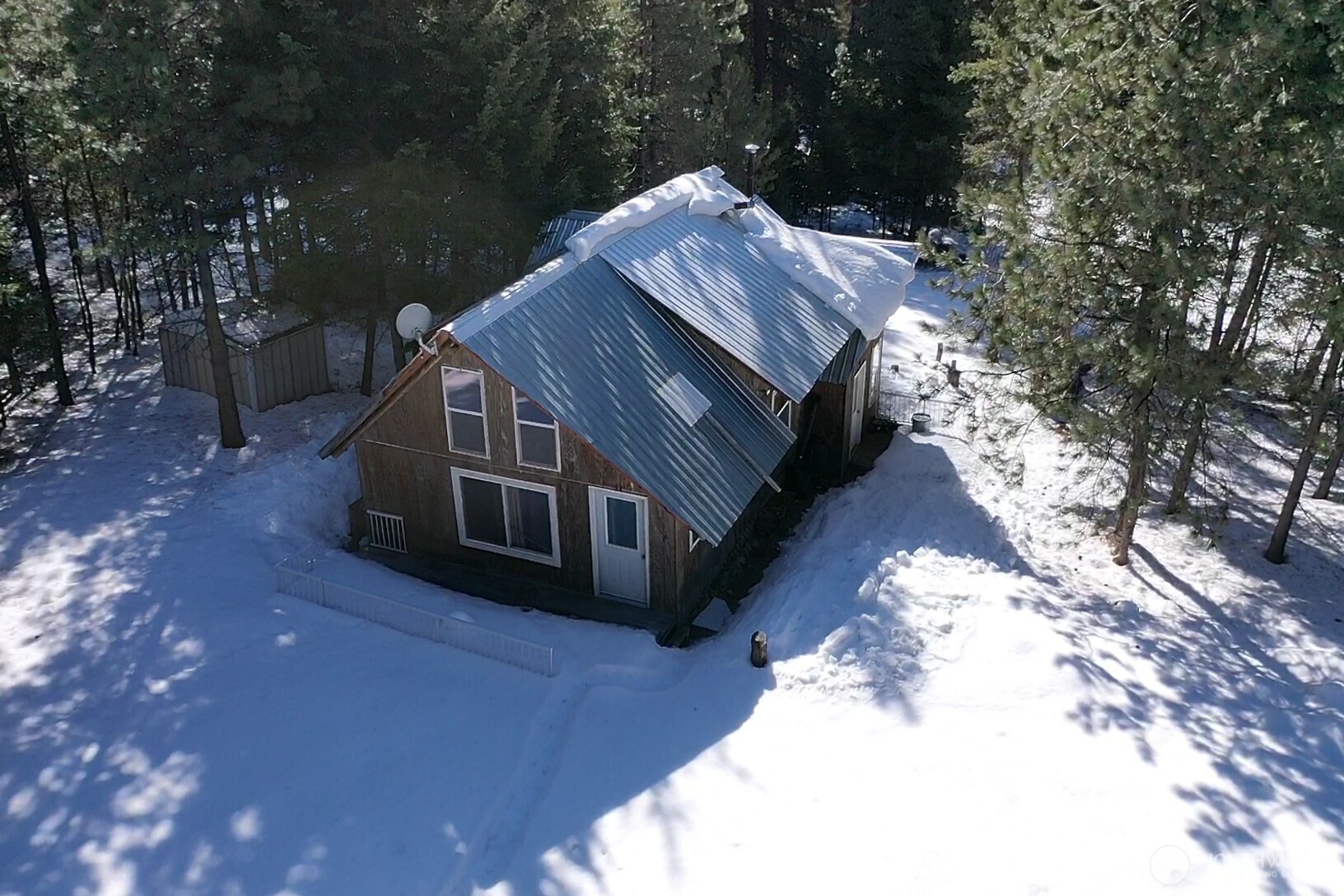 65A Spring Meadow Lane Oroville, WA 98844 - Photo 34 of 40 a view of house with yard and sitting area