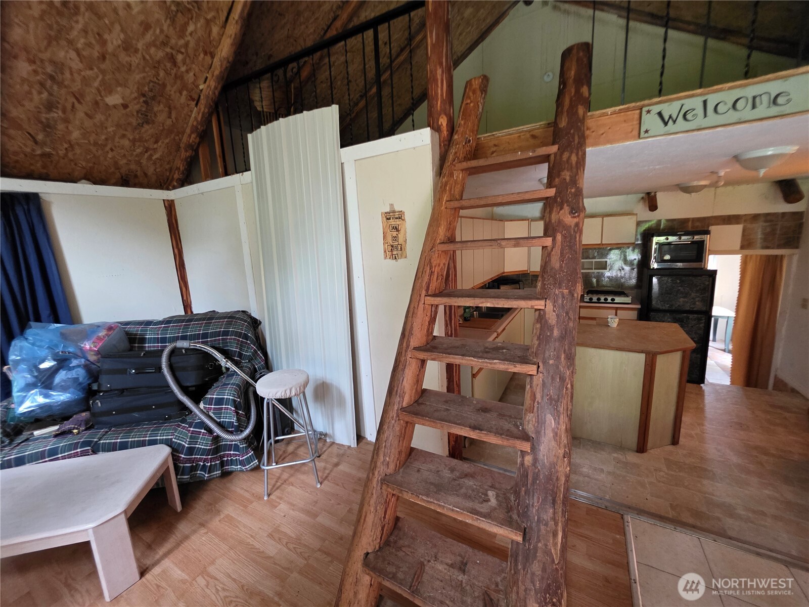 65A Spring Meadow Lane Oroville, WA 98844 - Photo 38 of 40 a view of a living room with furniture and wooden floor