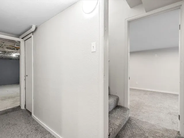 an empty room with a empty space and windows