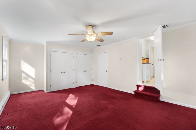 654 Suffern Road Teaneck, NJ 07666 - Photo 20 of 30 a view of livingroom with hardwood floor and ceiling fan