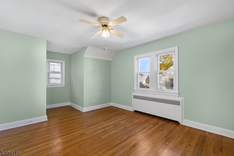 654 Suffern Road Teaneck, NJ 07666 - Photo 25 of 30 a view of an empty room with wooden floor and a window