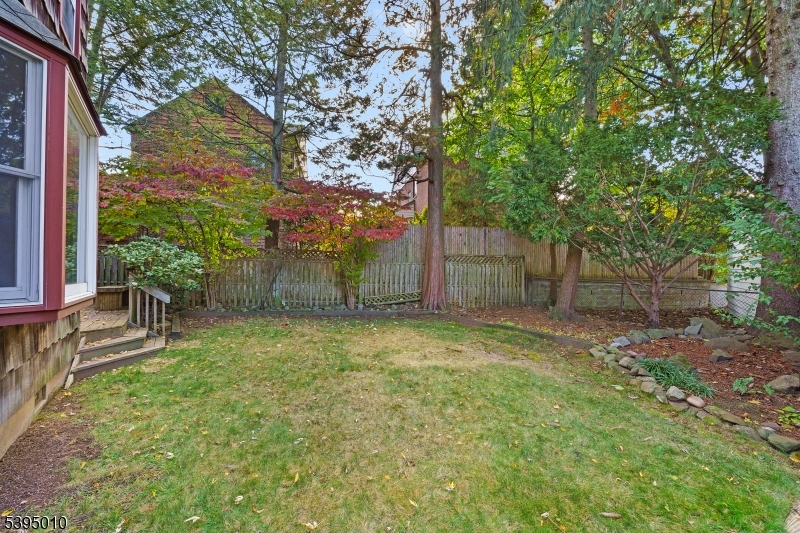 654 Suffern Road Teaneck, NJ 07666 - Photo 28 of 30 a backyard of a house with table and chairs