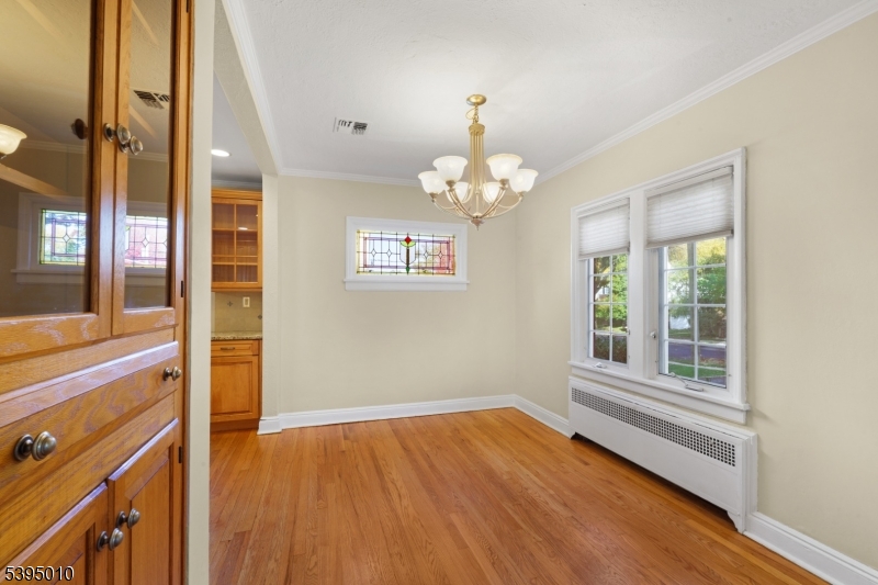 654 Suffern Road Teaneck, NJ 07666 - Photo 7 of 30 wooden floor in an empty room with a window